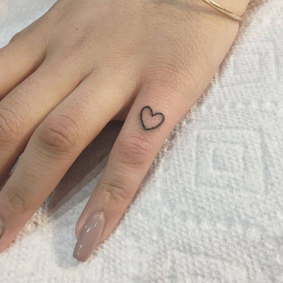 1. Tiny Heart Tattoos On Small Finger