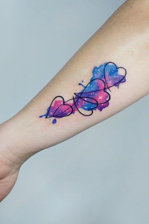 5. Galaxy Inspired Bright Heart Tattoo 