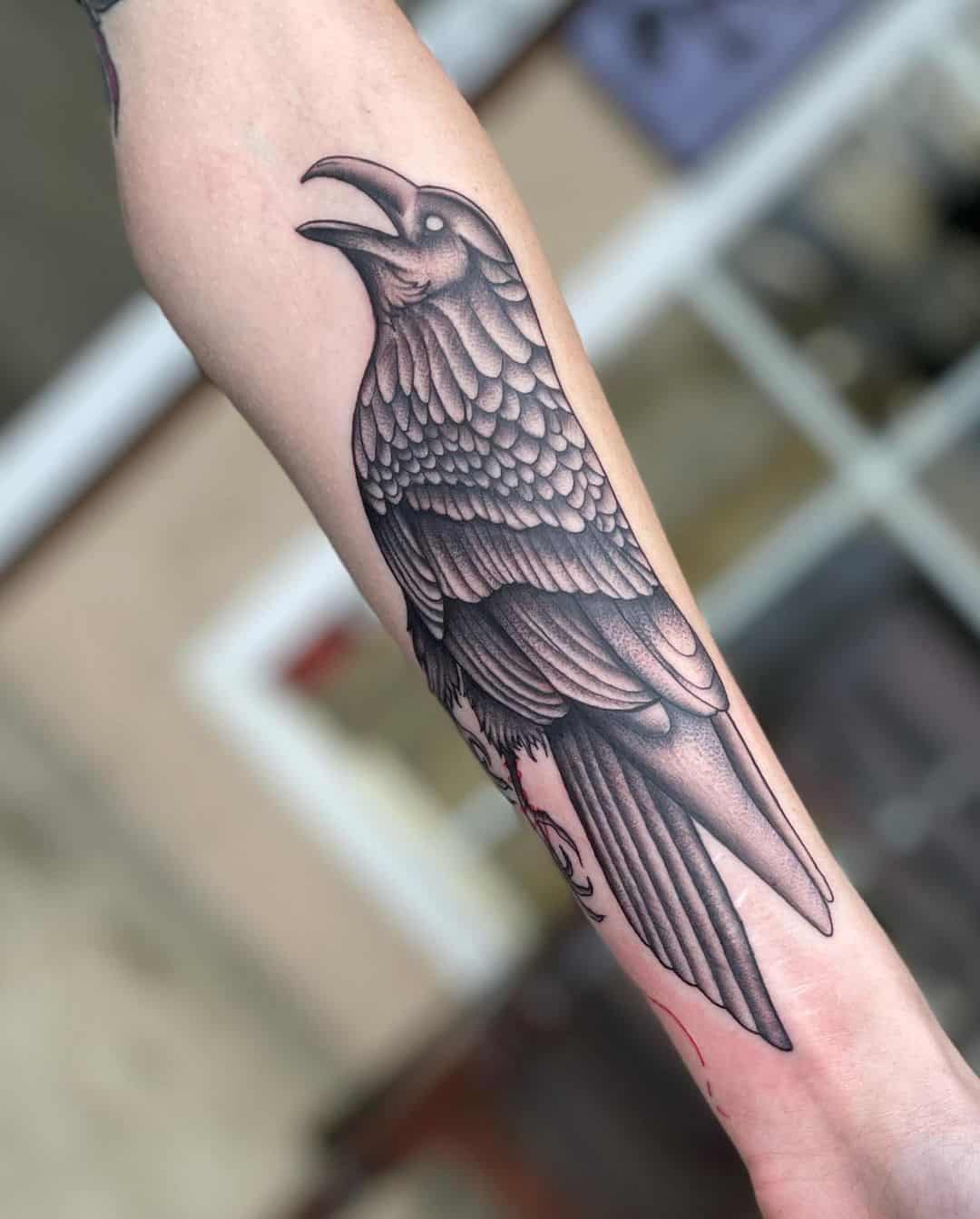 Detailed And Precise Raven Wing Tattoo 