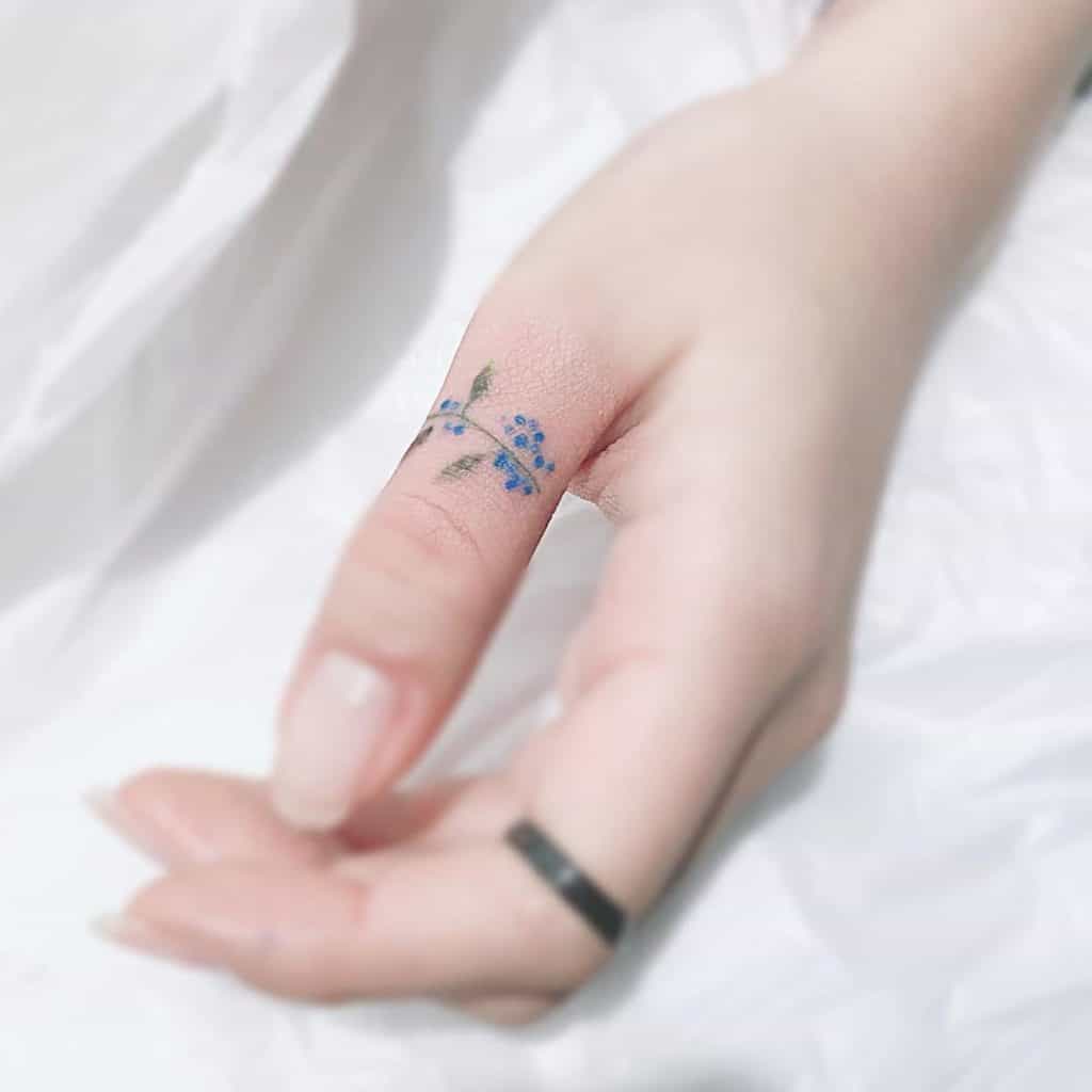 Small Finger Tattoos Bright Blue Ink