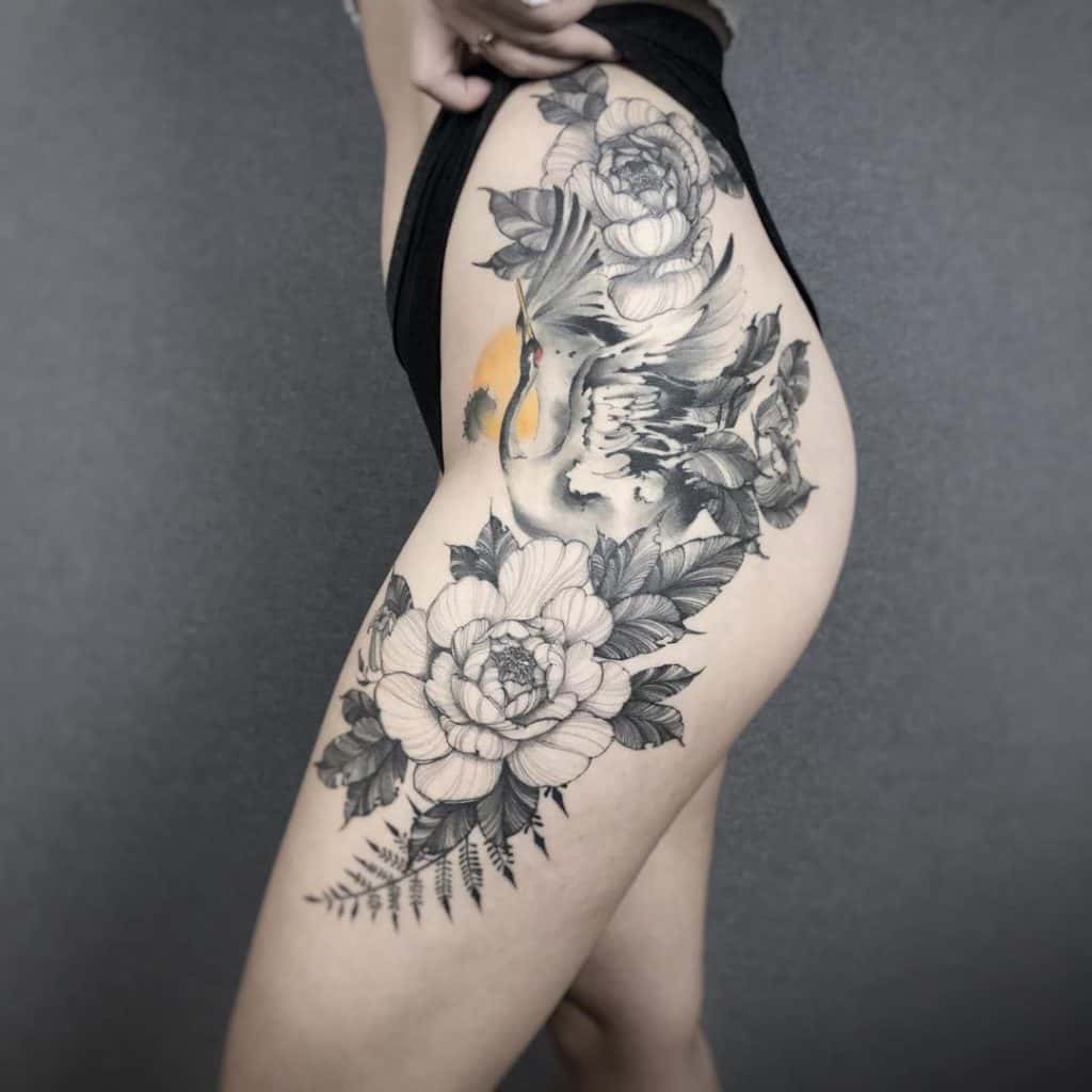 Flower Inspired Black Chinese Tattoo Over Leg