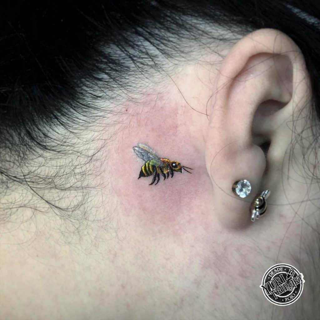 Bee tattoo behind ear 3