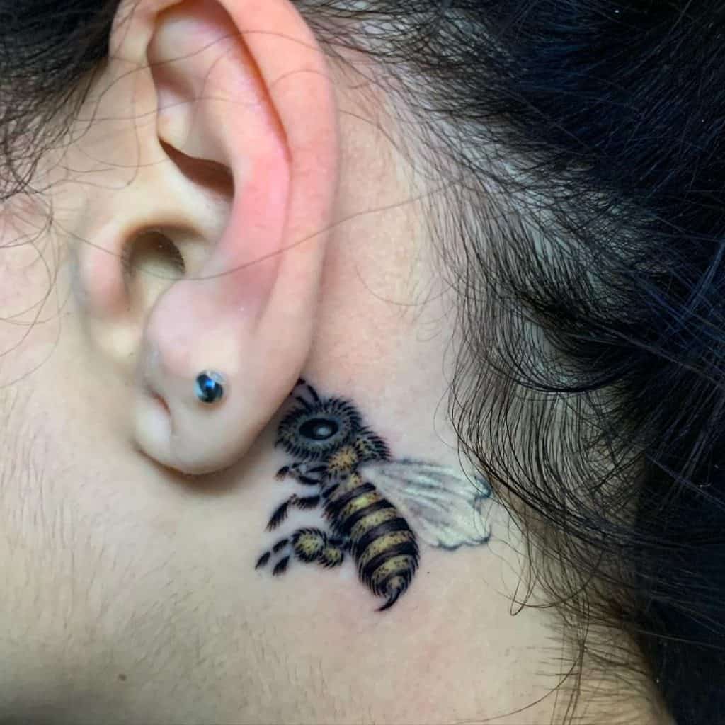 Bee tattoo behind ear 4
