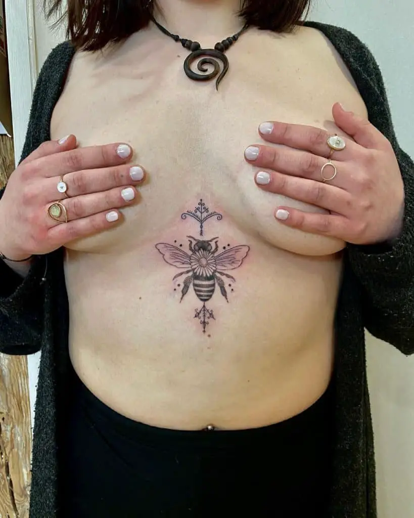 Bee tattoo on the chest 4
