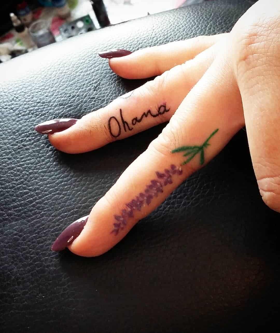 Lavender tattoo on a finger