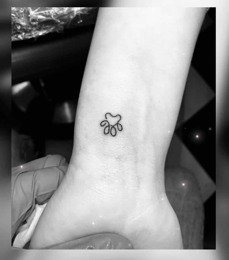Small Dog Paw Tattoo on the Arm