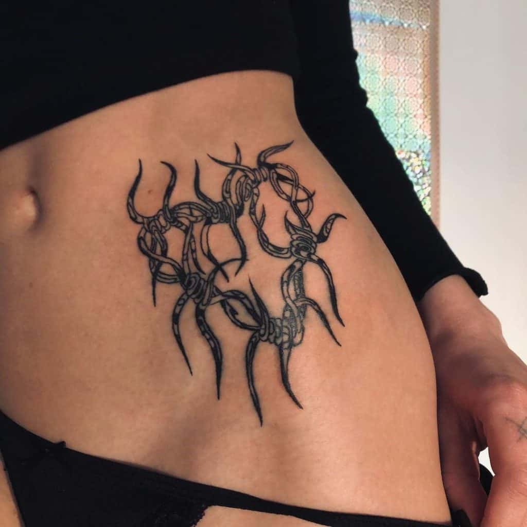 Spider Inspired Hip Tattoo 