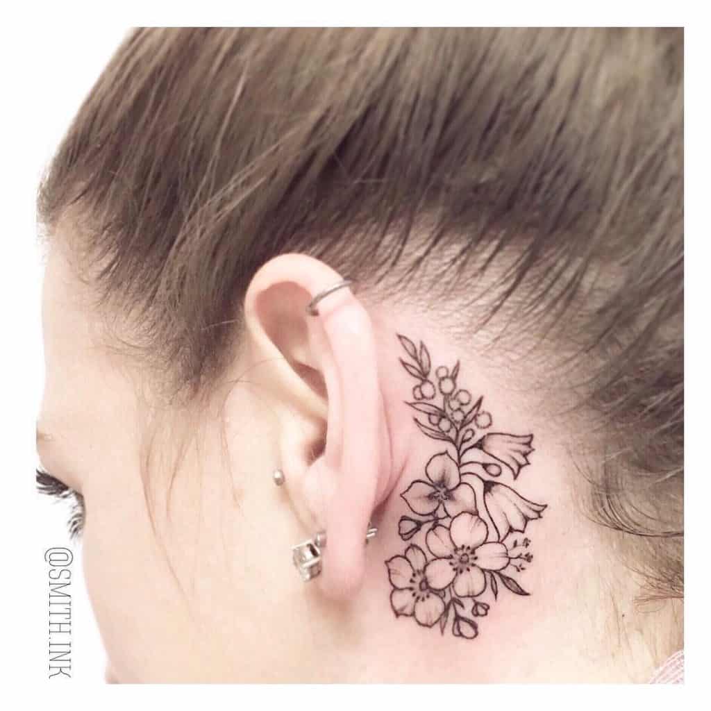 Tattoo In Front Of Ear Black Flowers 