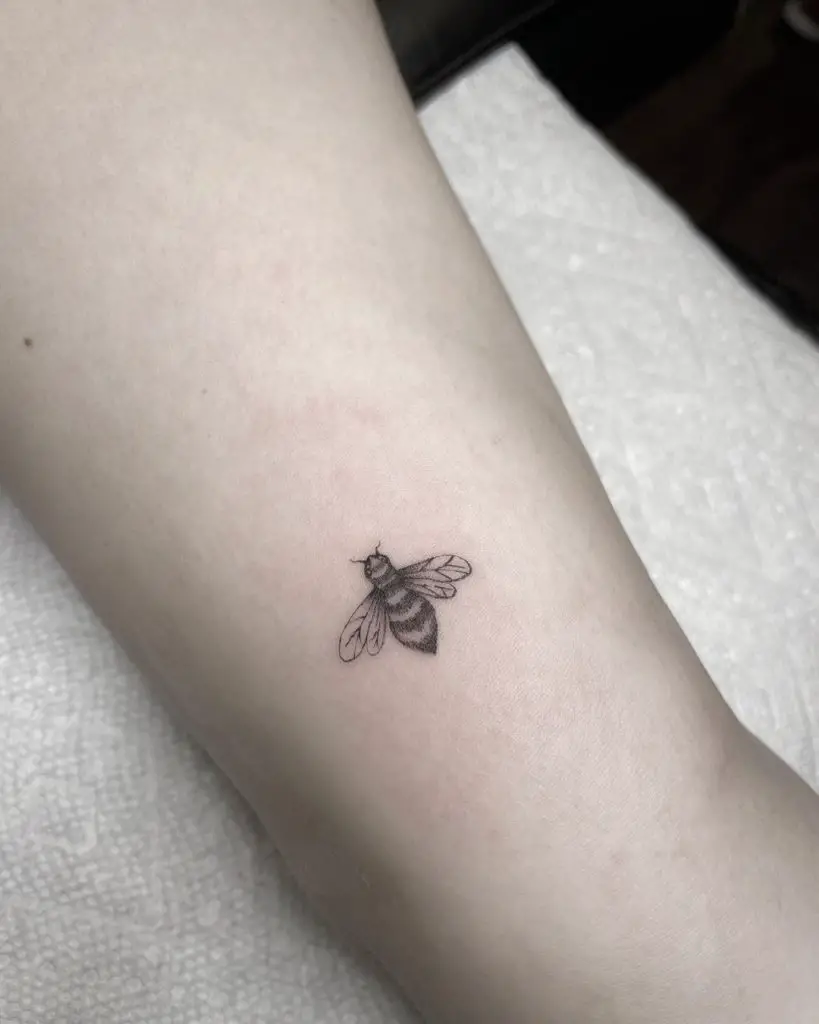 Tiny bee tattoo 1