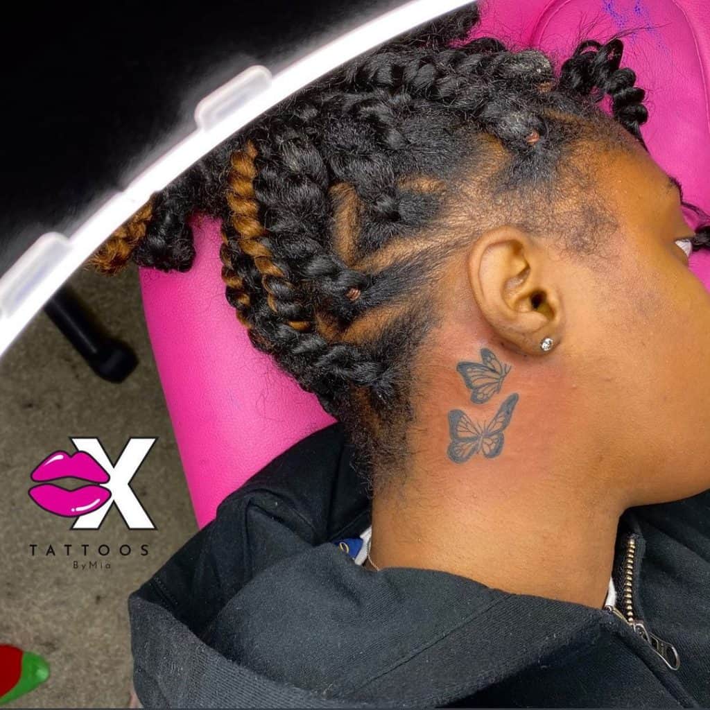 Butterfly neck tattoo 1