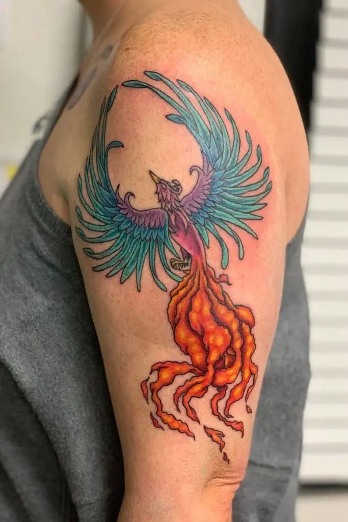 Colorful Bird Inspired Shoulder Tattoo 