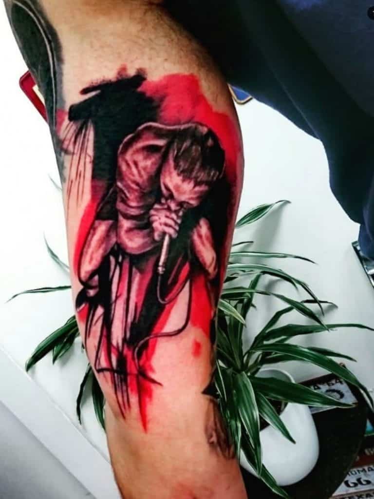 Dramatic Red Ink Trash Polka Tattoo 