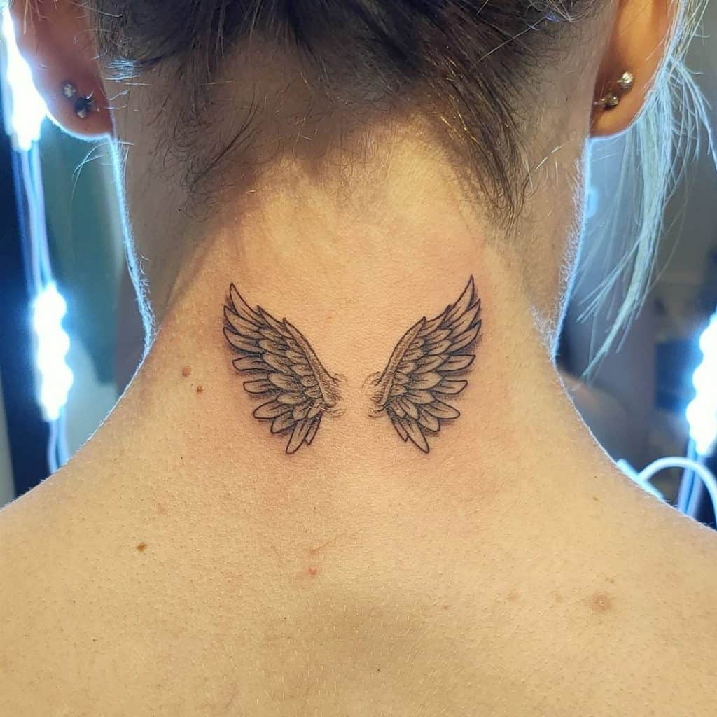 Wings neck tattoo 1