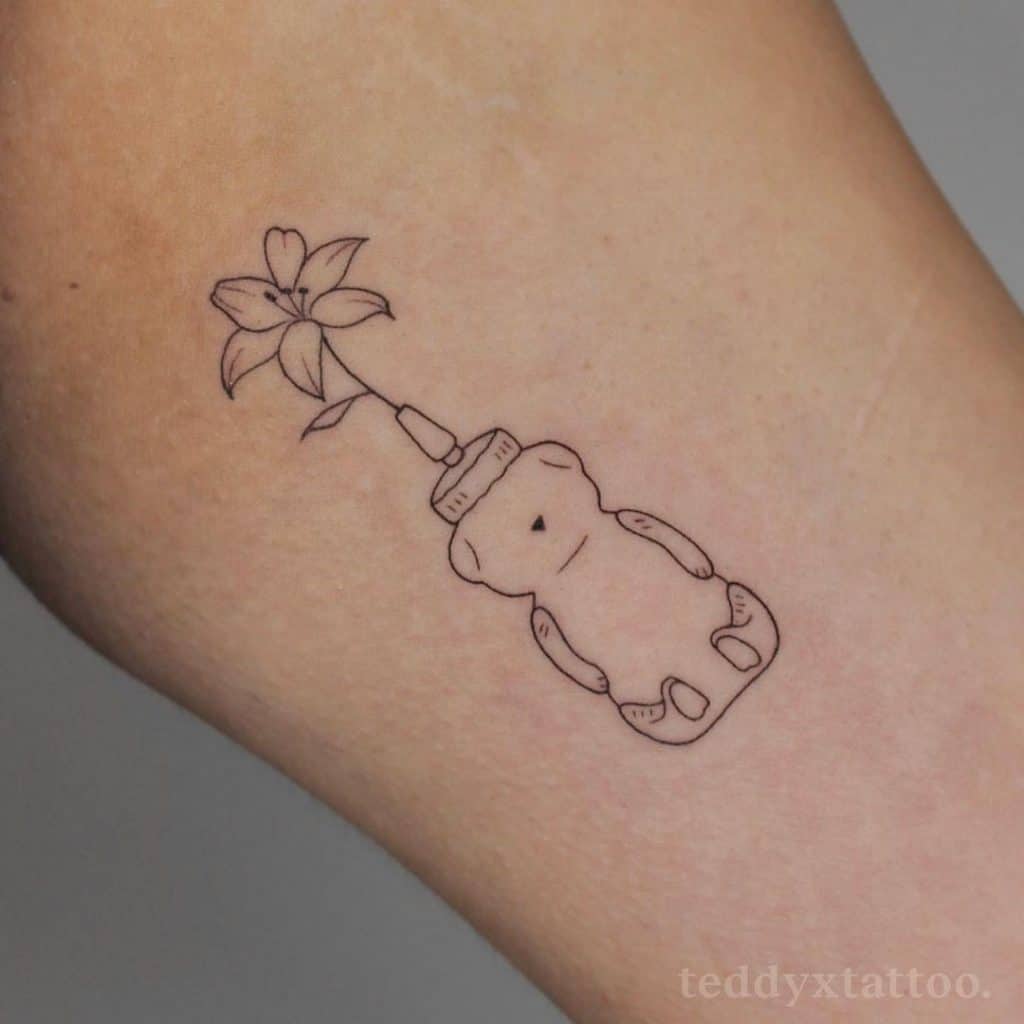 Small Lily Tattoo With Bear Ink