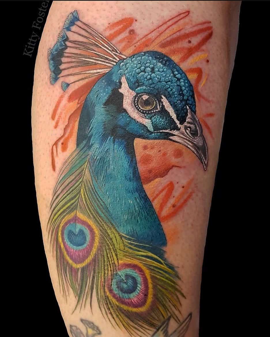 maliafincher: Ornate colorful tattoo of a peacock coming out of an egg