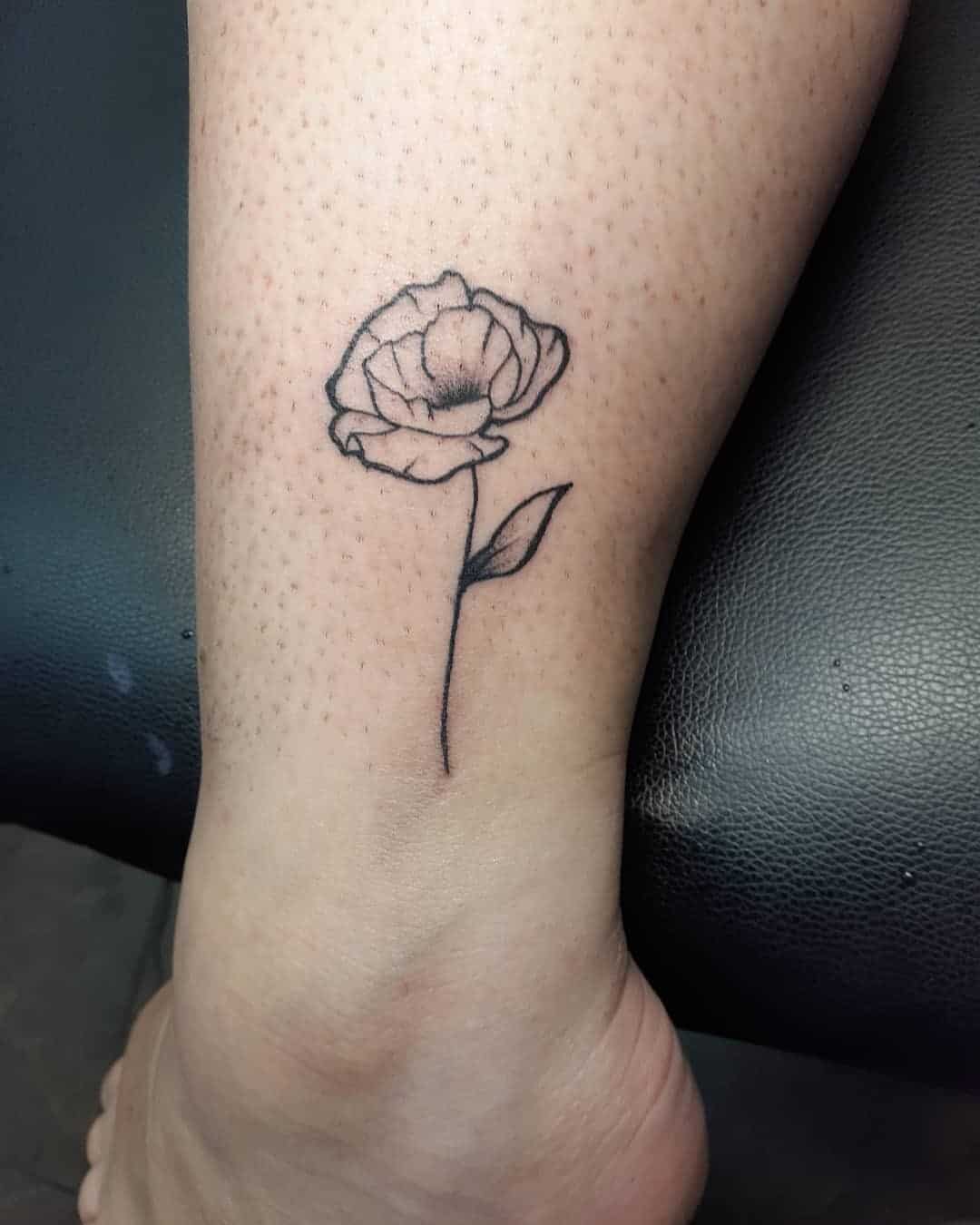 Black Poppy Flower Tattoo Idea