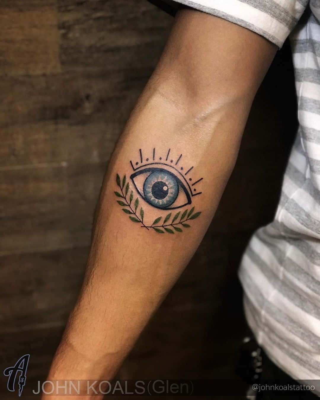 Blue Ink Evil Eye Tattoo Arm Ink