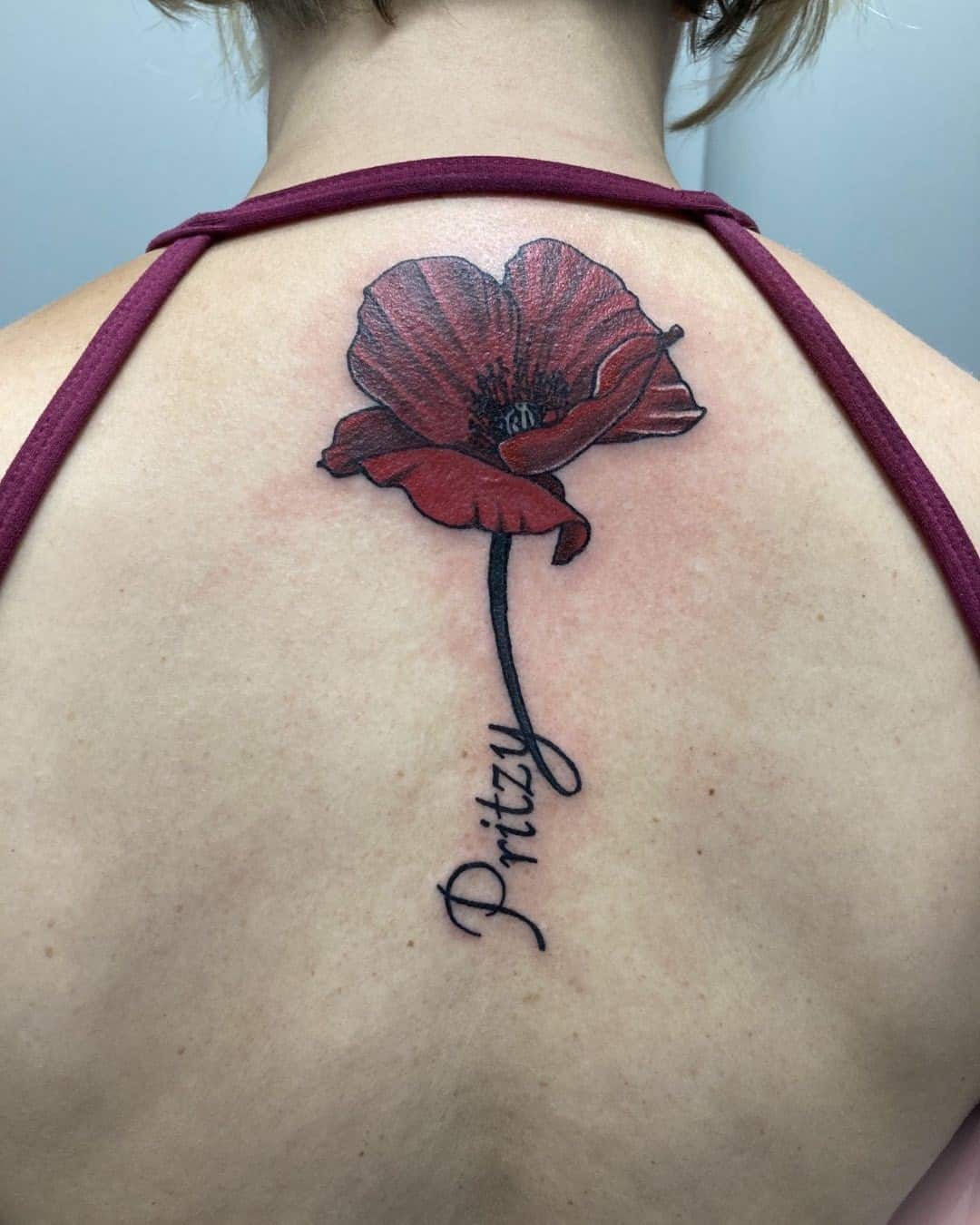 Dark Red Poppy Flower Tattoo Over Back