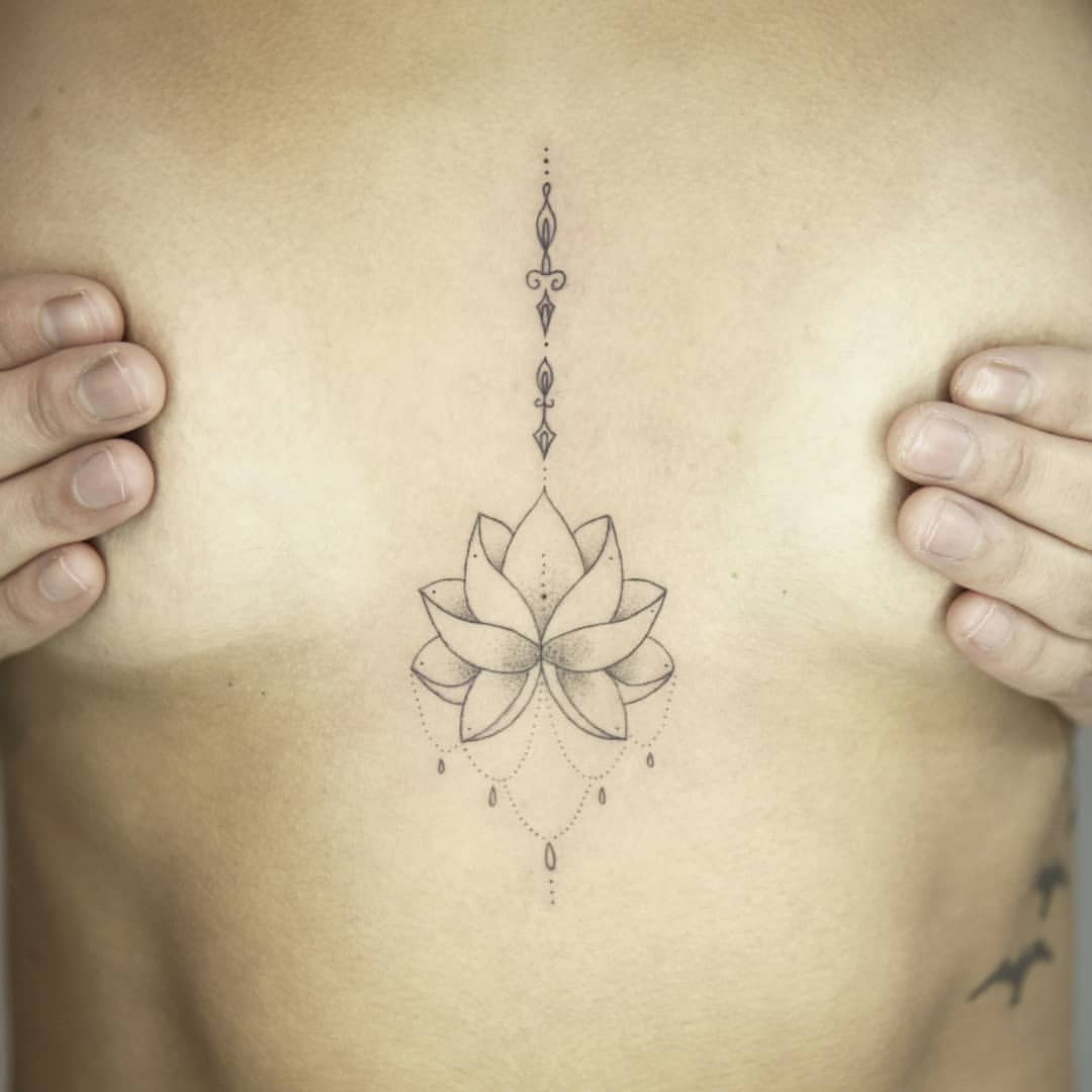 lotus flower tattoo on sternum