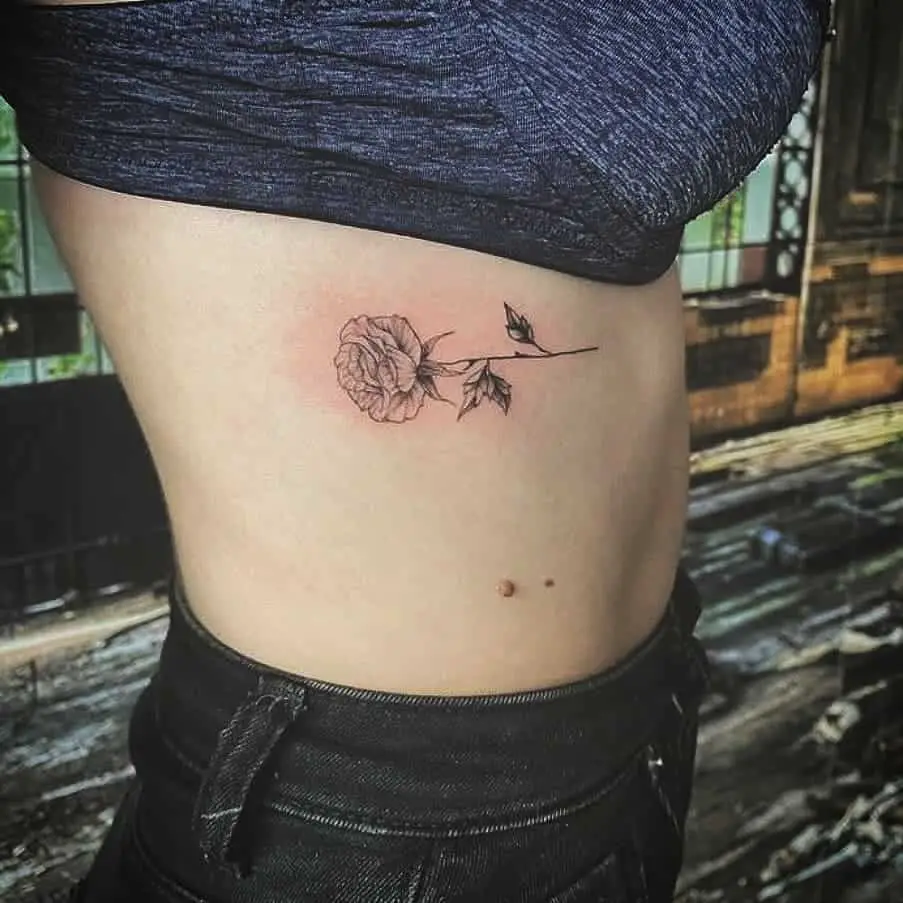 Side tattoo of a flower on Mixandra.