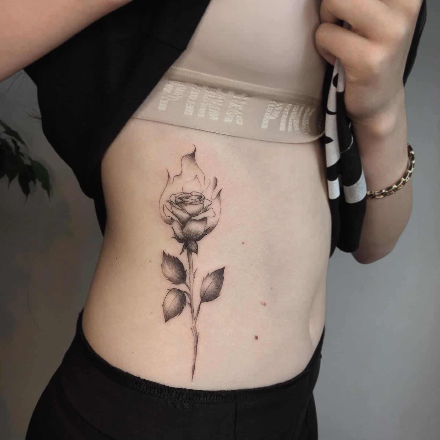 Girl With Rose Tattoo On Left Side