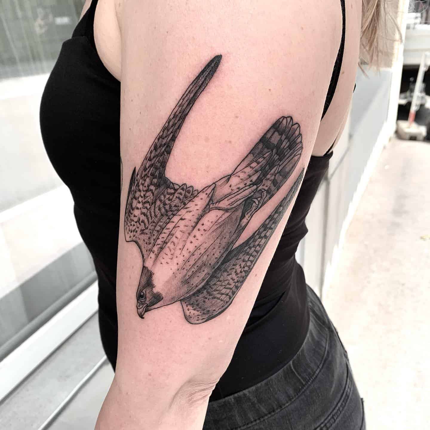 Symbolic Bird Arm Tattoo