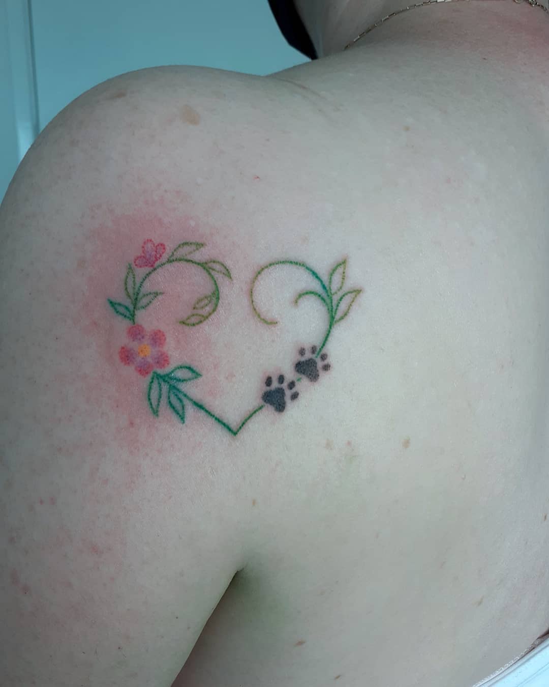 Symbolic Womens Shoulder Tattoo