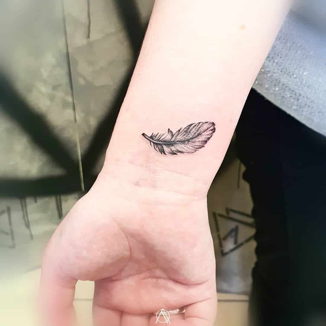 Wrist Feather Tattoo 
