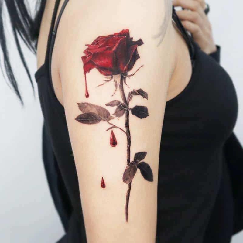 Dark red rose tattoo