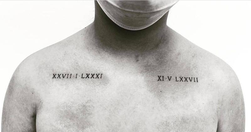 Roman numerals chest tattoo 2