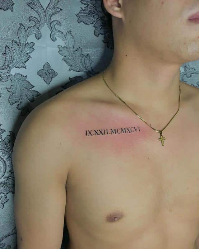 Roman numerals chest tattoo 5