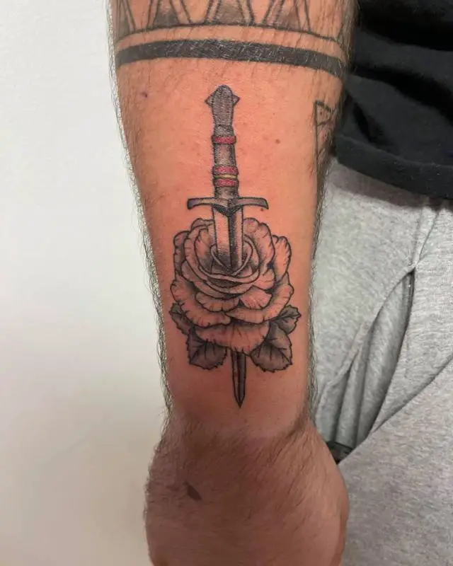 Pierced Dagger And Rose Tattoo 2