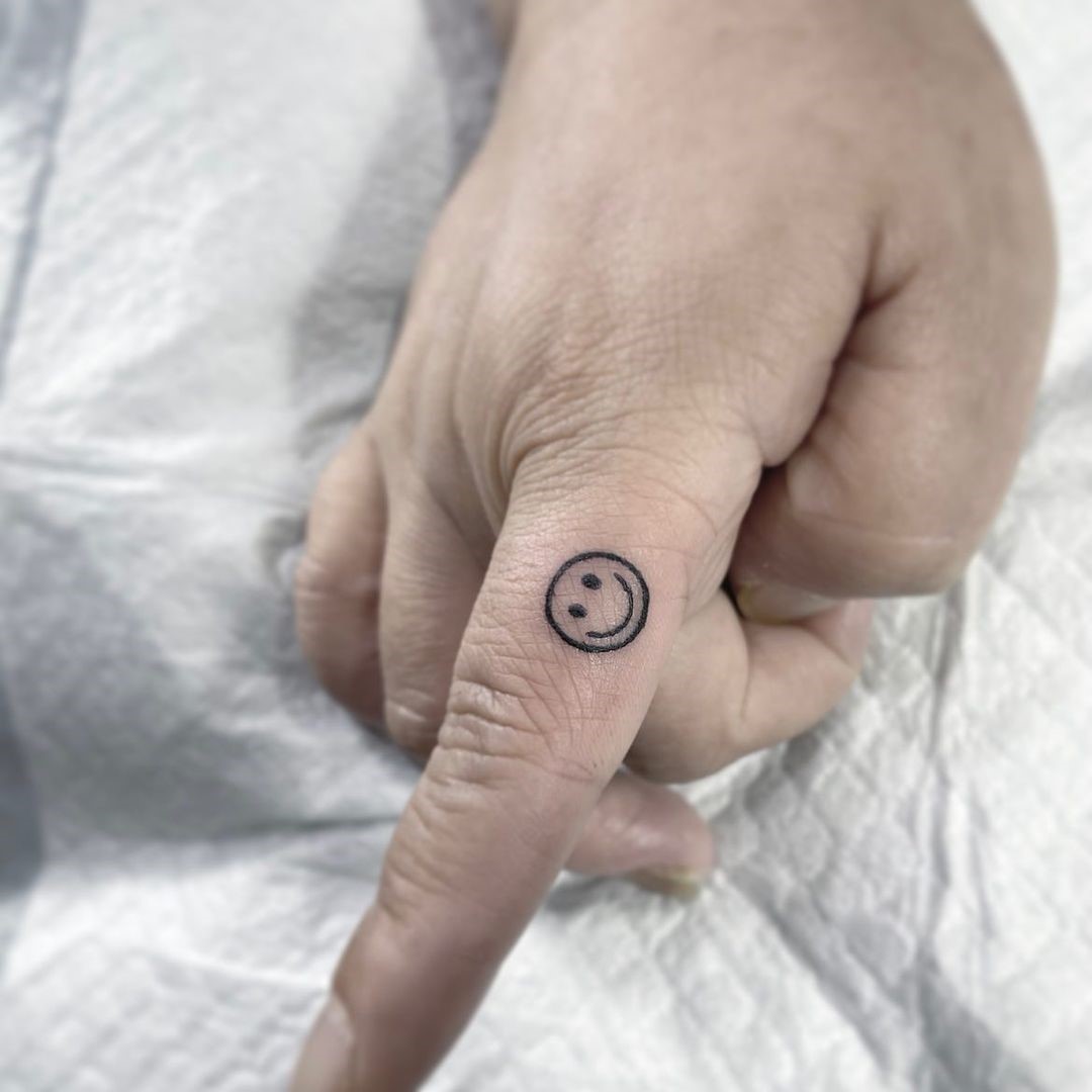 Smile Tattoo On Finger 