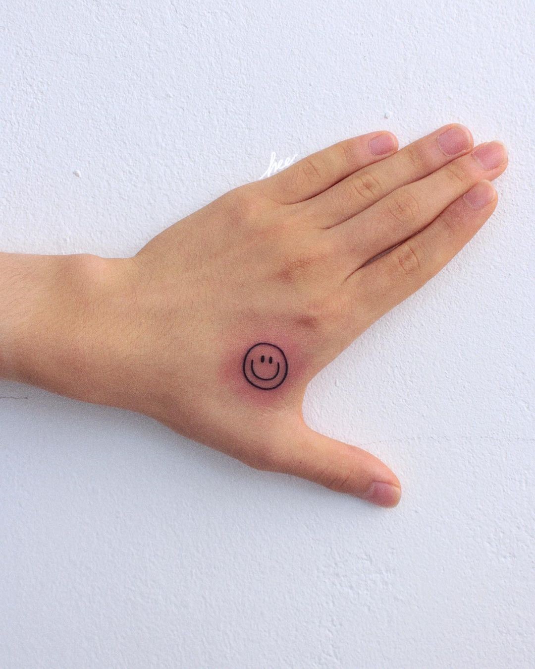 Smiley Face Tattoo On Hand