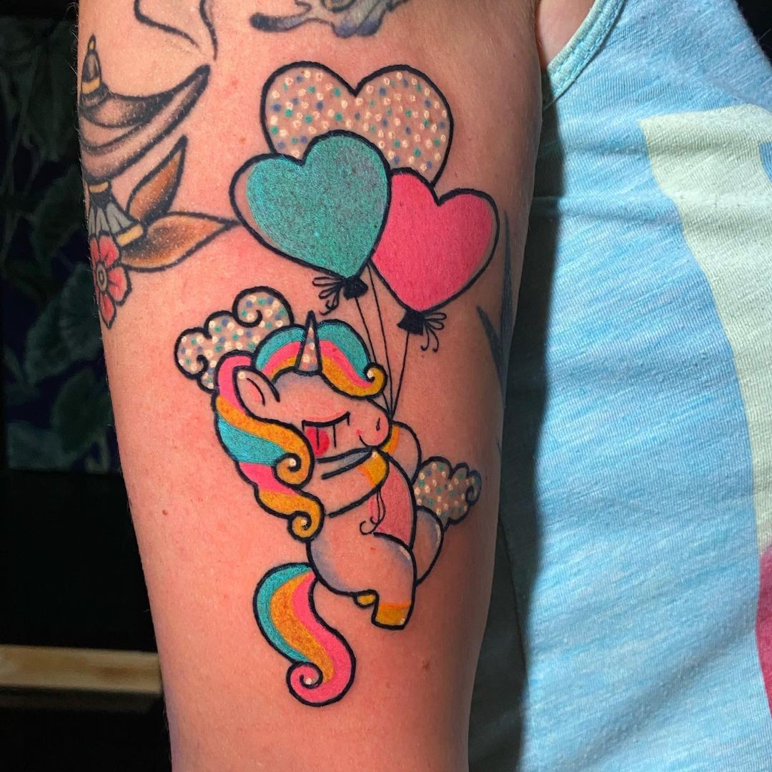 Unicorn Tattoo Design With Heart Prints 
