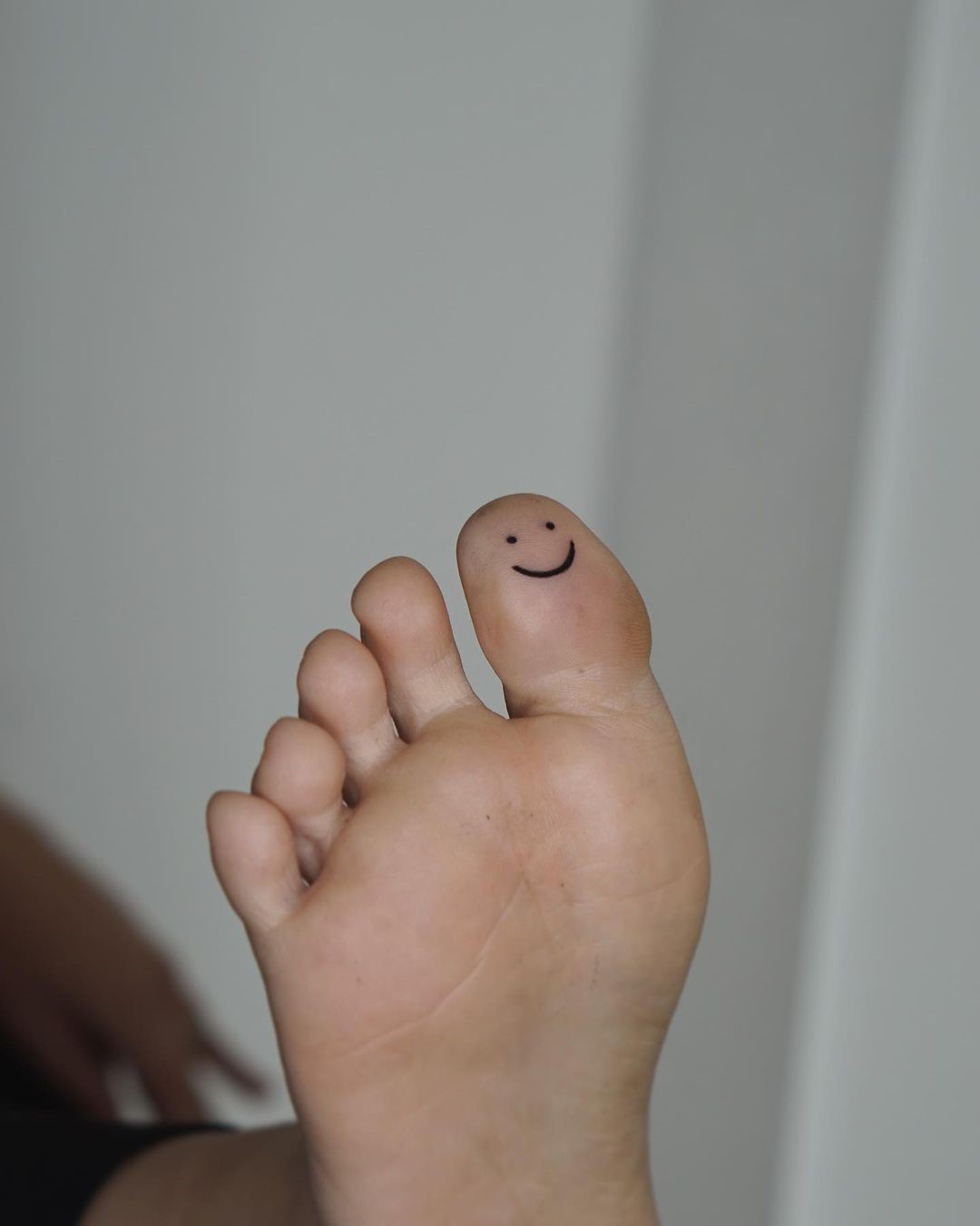 Smiley Tattoos On Bottom Of Toe and Fingers