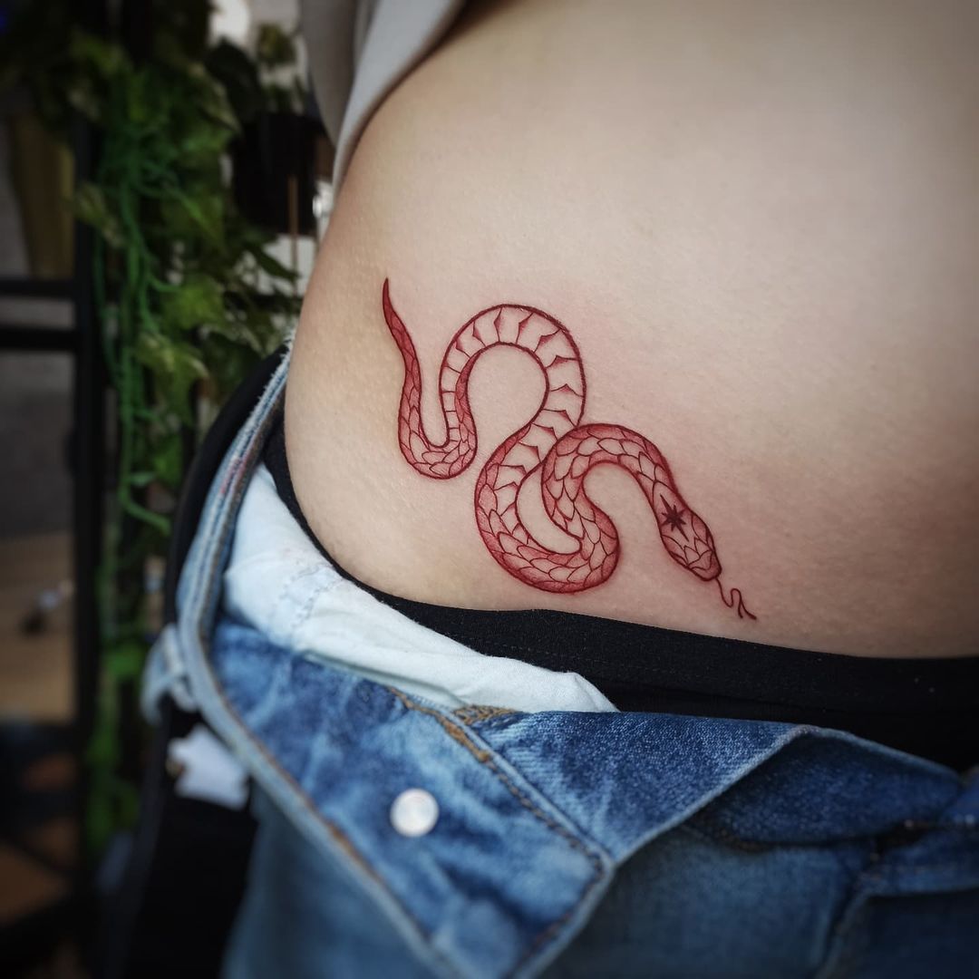 red snake tattoo women hip