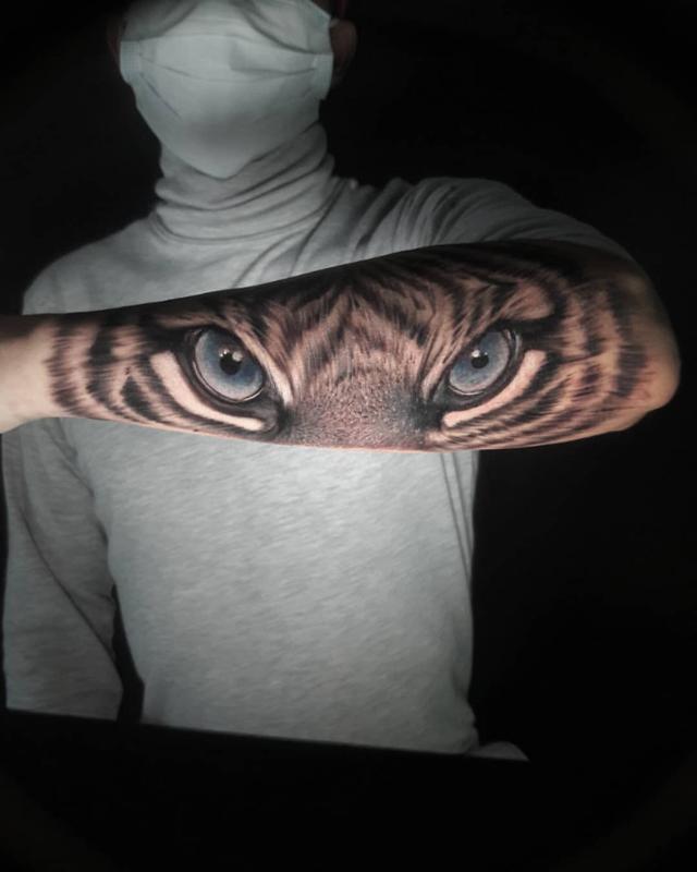 Angry Blue Tiger Eyes Tattoo Design
