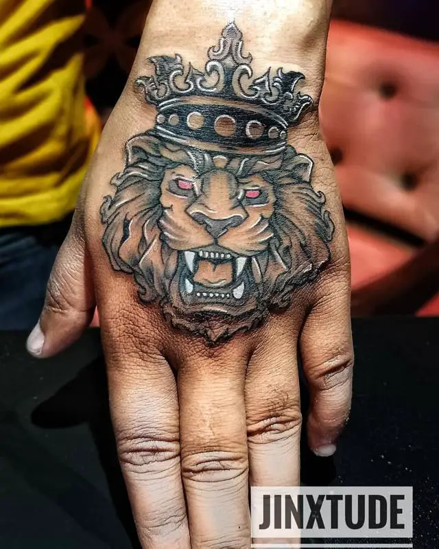Lion With Crown Tattoo On Hand 1