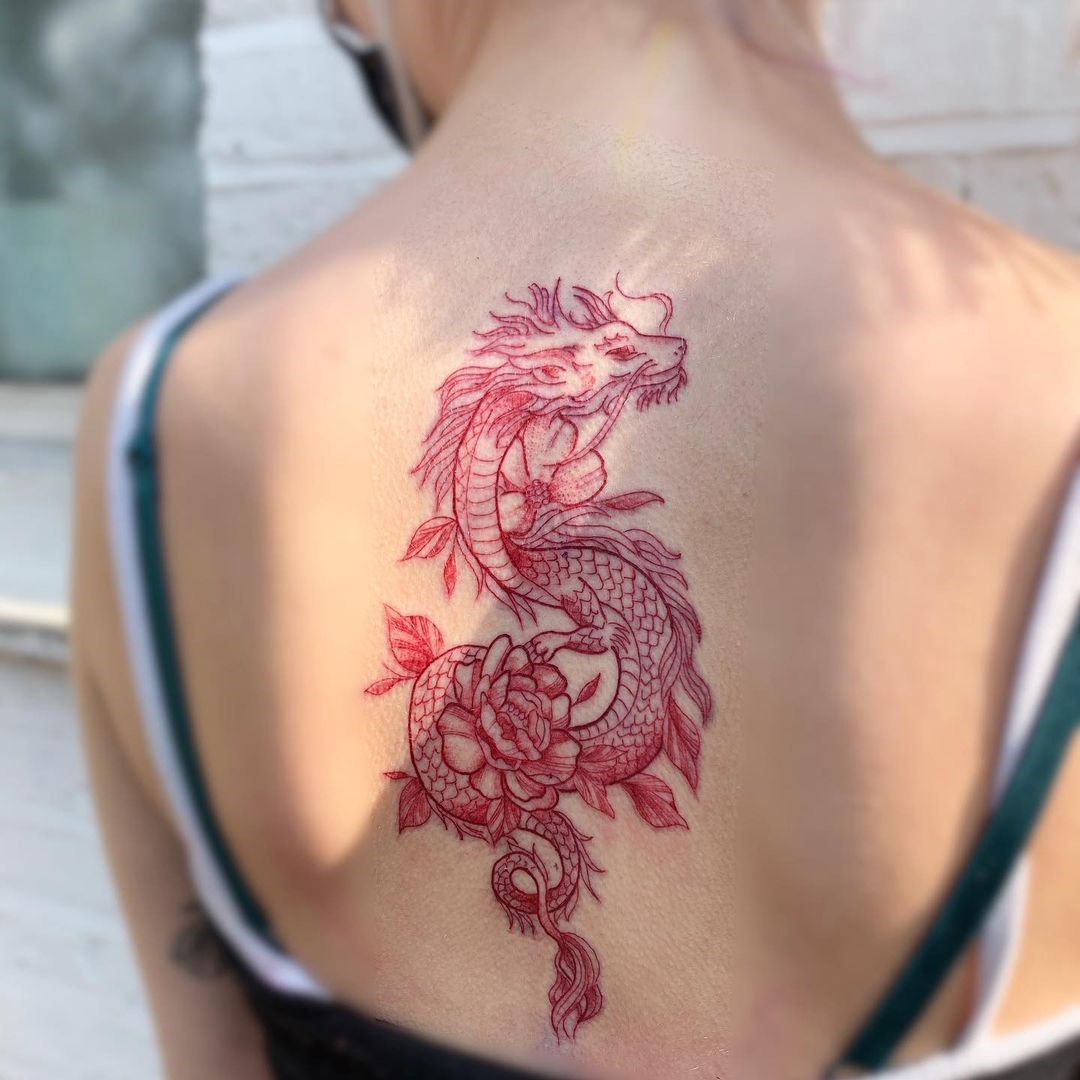 Red Dragon Surrounded By Flowers Tattoo Design