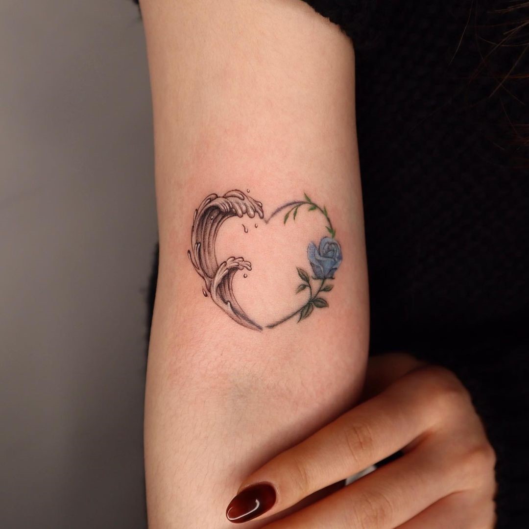 Small Wave Tattoo With A Rose