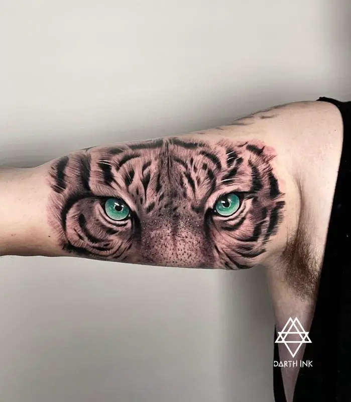 Amazing Tiger Eyes Tattoo On Man Right Arm by Angry Mom Tattoo Studio