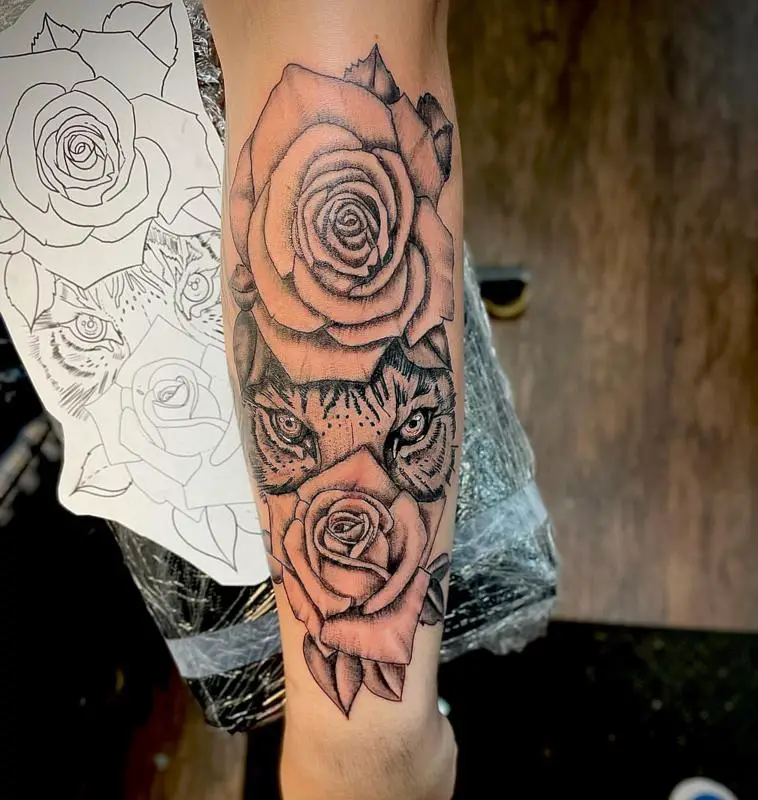 Tiger Eyes Hiding Behind The Roses Tattoo Design