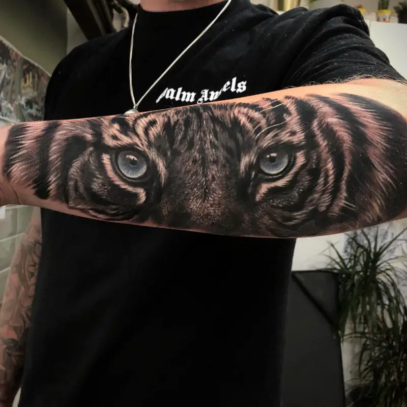 Transparent Tiger Eyes Tattoo Design