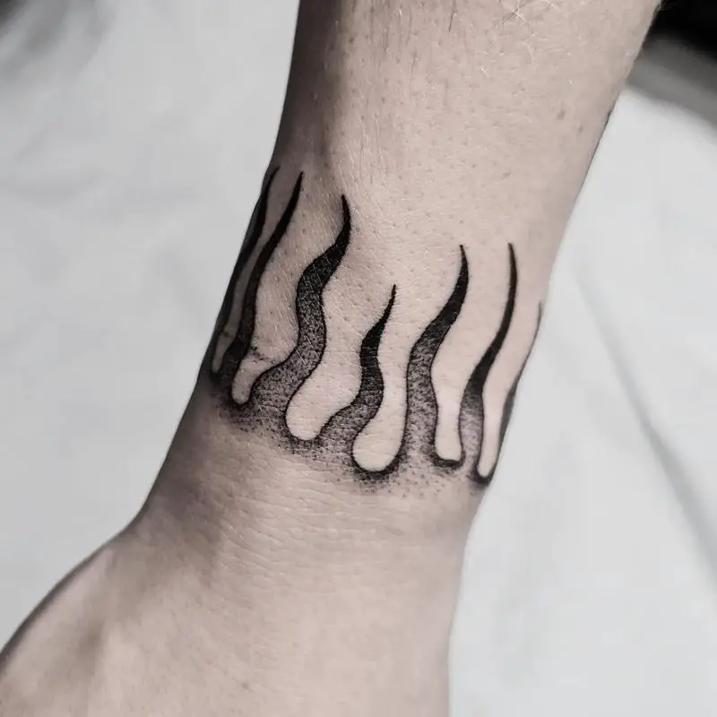Flame Tattoo Starts At Wrist - Tattoo Ideas and Designs | Tattoos.ai