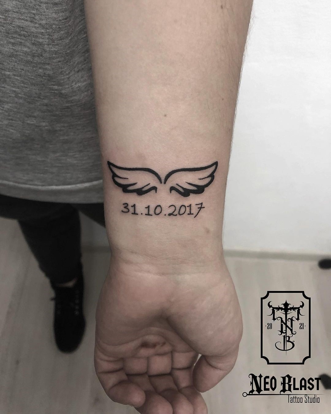 Small Forearm Wing Tattoo