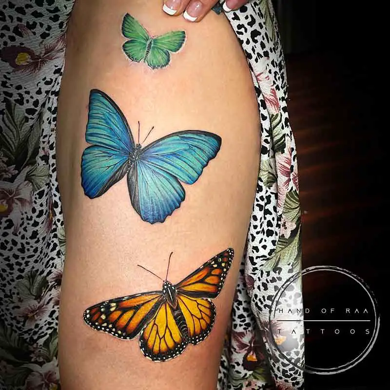 Blue and orange butterfly tattoo